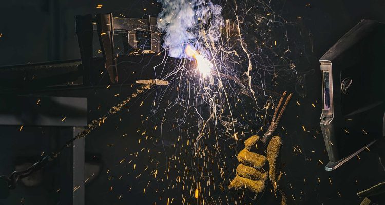 side-view-of-welder-in-protection-mask-working-wit-2N7QKN3.jpg